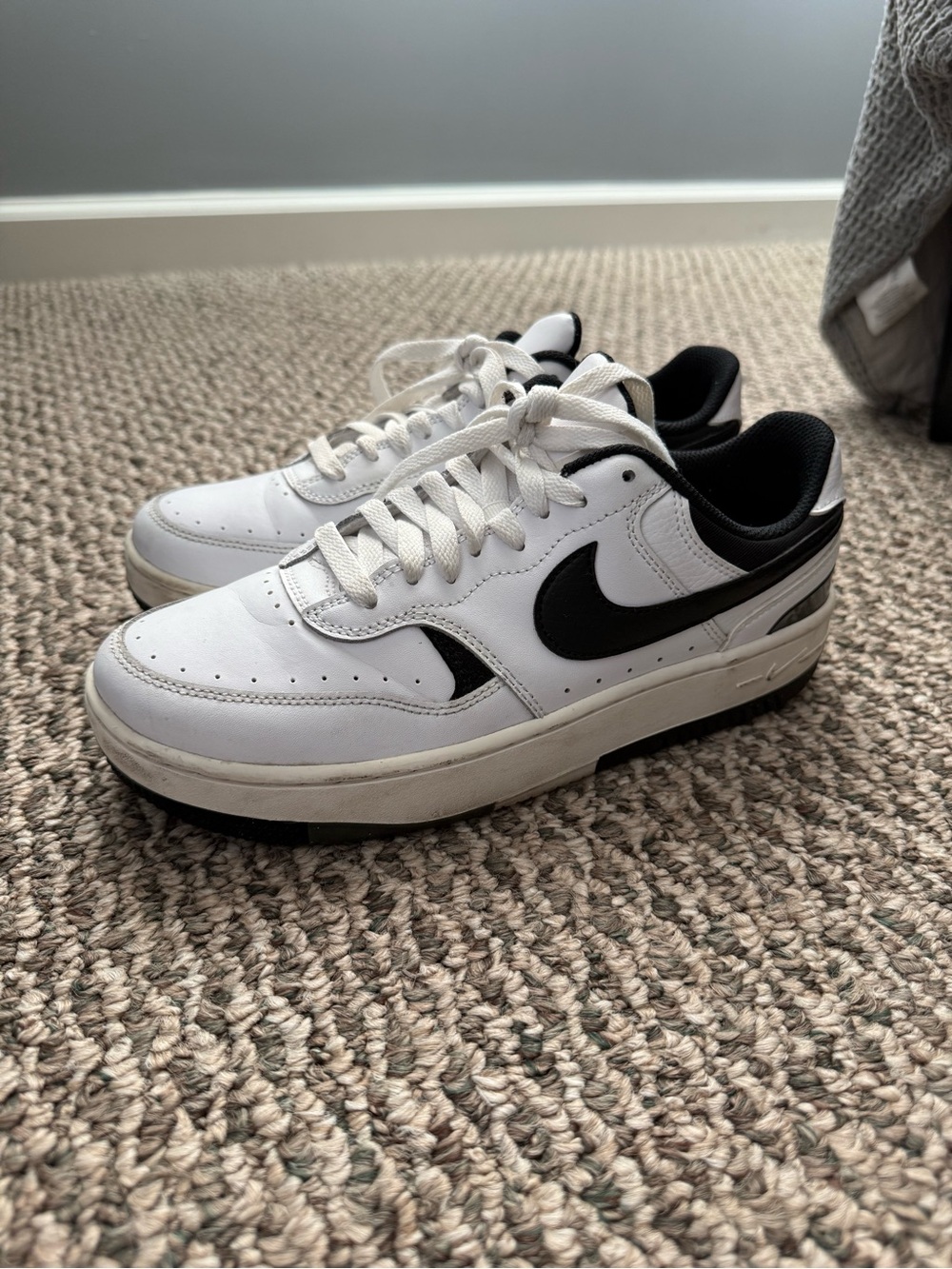Nike Women’s White and Black Low-Top Sneakers with Black Swoosh